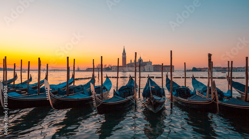 Sunrise at Venice with gondola and island photo