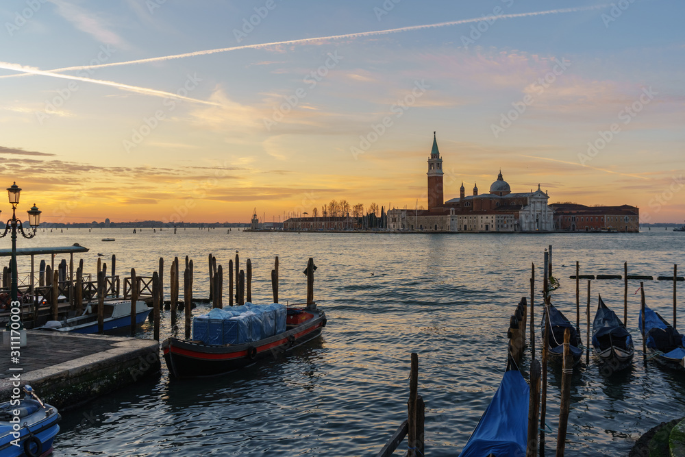 Sunrise at Venice with gondola and island