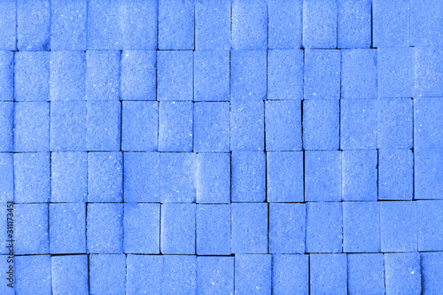Pattern with pieces of sugar toned in the color of the year 2020 classic blue on classic clue background.