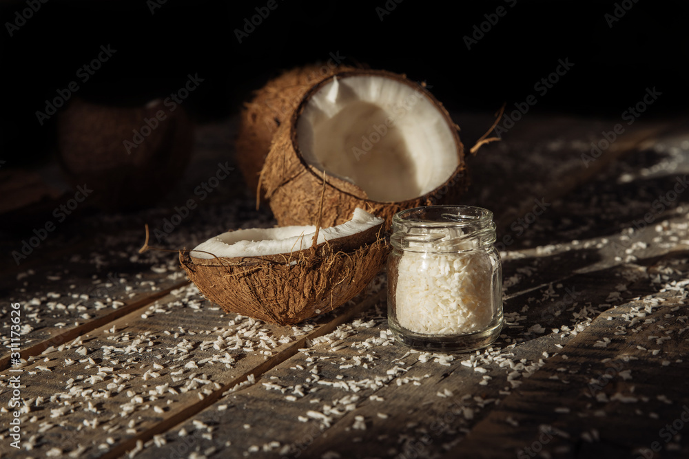 .coconut and milk , broken coconut, coconut on wooden boards background .coconut and milk , broken coconut, coconut on wooden boards background