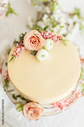 White wedding cream cheese cake with flowers decorations. Engagement party cake  anniversary cake  birthday cake
