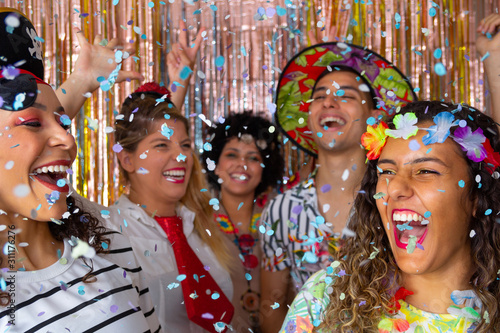 Friends laughing and dancing at Carnival in Brazil. Dressed Group of female friends partying in nightclub. © Vergani Fotografia