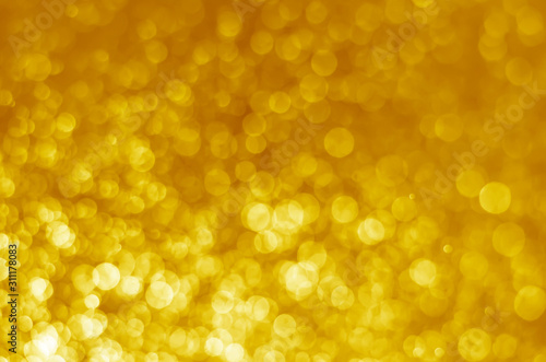 abstract yellow bokeh glitter sparkle background.