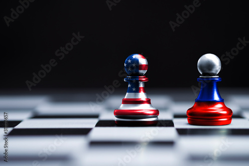 USA and Russia flag print screen on pawn chess with black background.It is symbol of tariff trade war tax barrier between United States of America and Russia.-Image.
