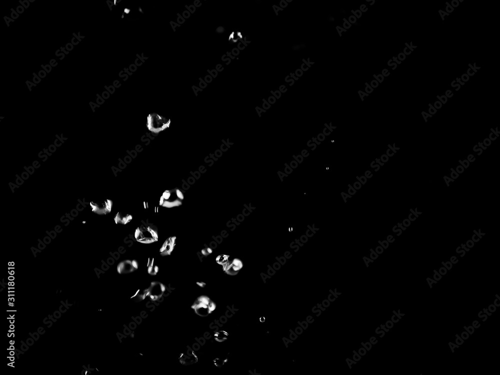 White bubbles on a black background. White bokeh. Black and white images. White bubbles on a black background. White bokeh. Black and white images.