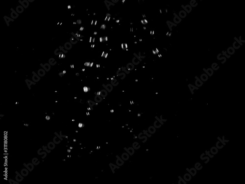 White bubbles on a black background. White bokeh. Black and white images.