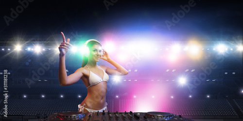 Cute dj woman at console. Mixed media © Sergey Nivens