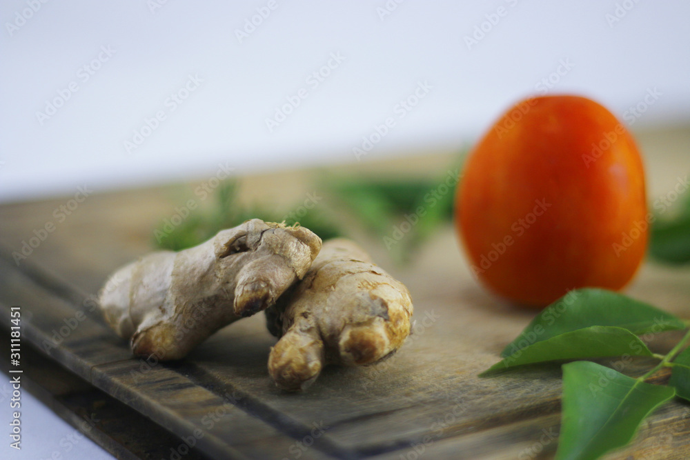 Fototapeta premium Fresh ingredients for cooking with tomato, ginger and chilly..