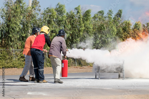 Firefighter training,Instructor training how to use a fire extinguisher for fighting fire