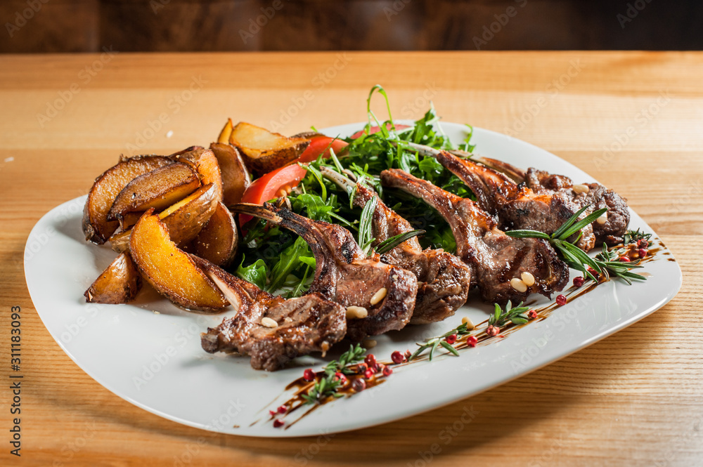 Grilled ribs cooked with vegetables and rosemary. Grilled ribs cooked with vegetables and rosemary.