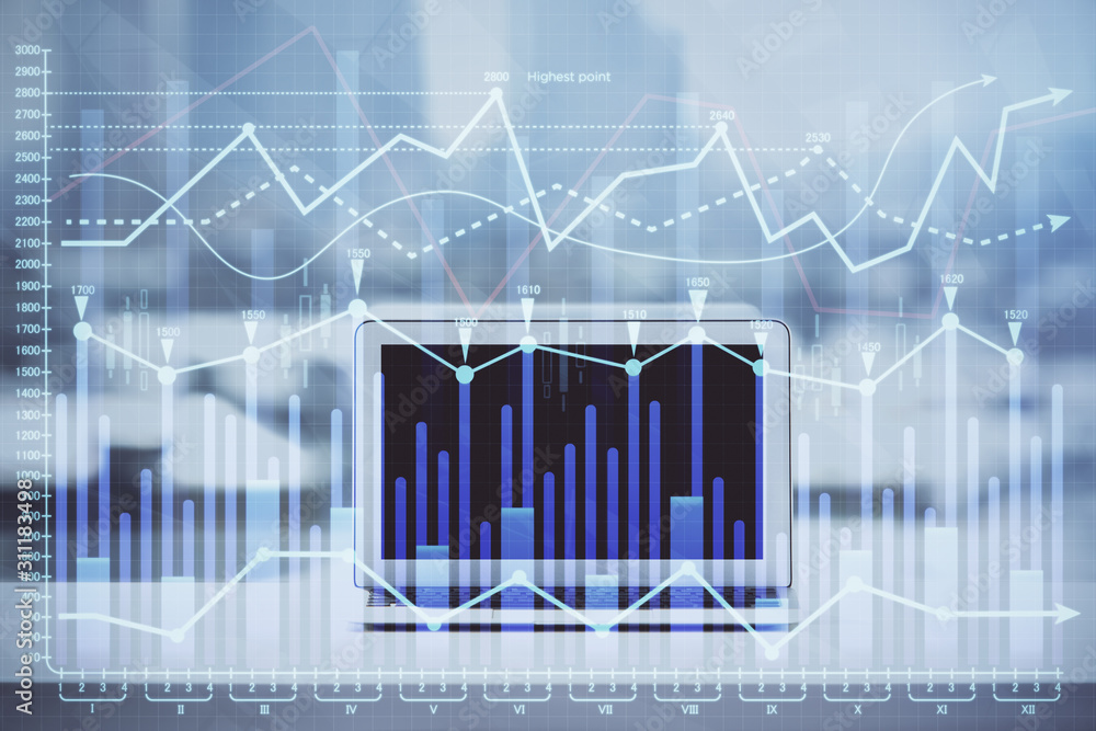 Forex Chart hologram on table with computer background. Double exposure. Concept of financial markets. Forex Chart hologram on table with computer background. Double exposure. Concept of financial markets.