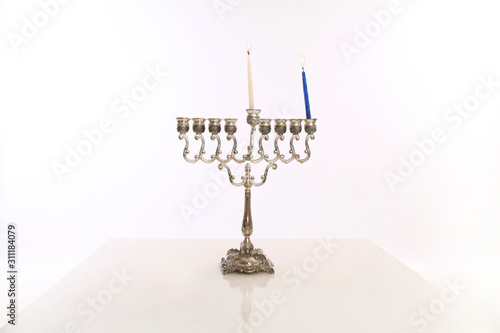 hanukkah menorah one candle white background