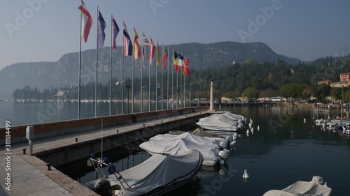 Harbor and Flags. Garda Lake, Italy. photo