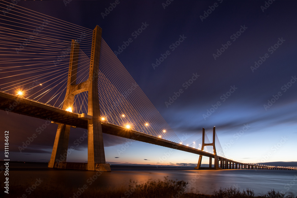 Fototapeta premium bridge Vasco da Gama in Lisboa, Portugal to the sunrise