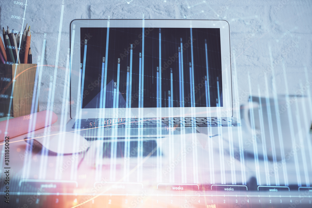 Forex Chart hologram on table with computer background. Multi exposure. Concept of financial markets. Forex Chart hologram on table with computer background. Multi exposure. Concept of financial markets.