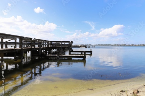 Wooden jetty overlooking lake on a clear sunny day © AndyCBR1000RR