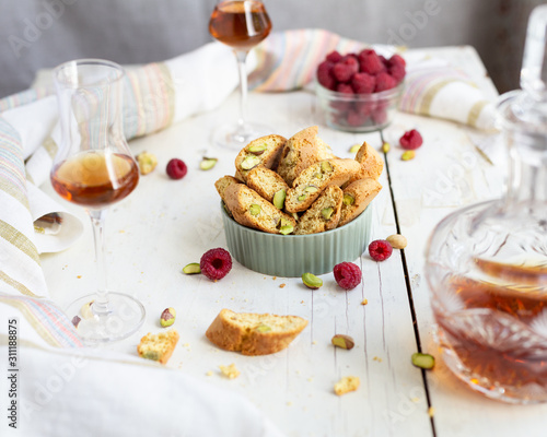 biscotti - italian cookies with pistachios  raspberries  a glass of brandy