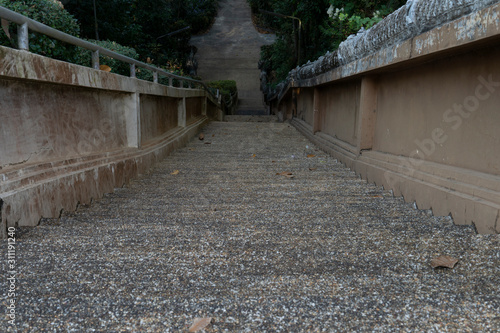 Stair high to the bottom at Wat Sai Ngam Chanthaburi Thailand. © thongchainak