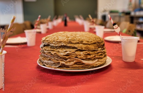 Bild auf Leinwand stack of pancakes on a red tablecloth