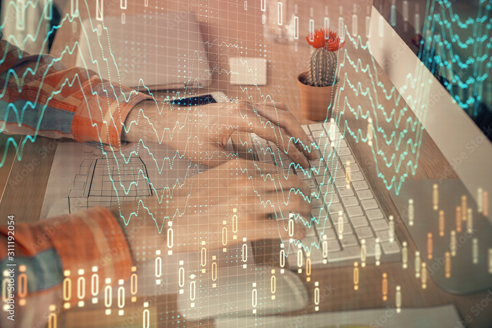 Double exposure of stock market chart with man working on computer on background. Concept of financial analysis. Double exposure of stock market chart with man working on computer on background. Concept of financial analysis.