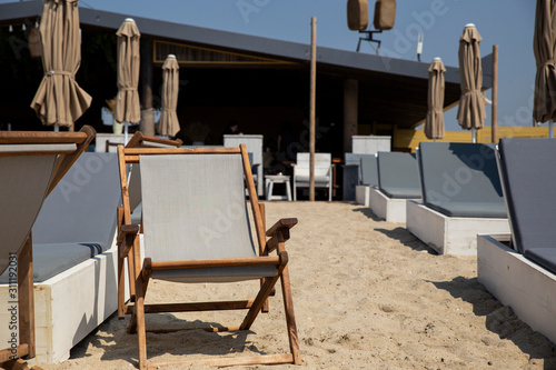 Seats at a beach bar in the summer in the Epanomi area of Greece photo