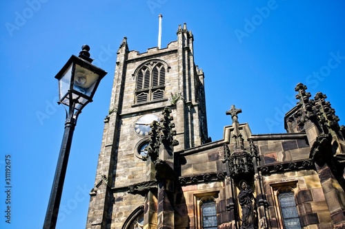 Lancaster Priory with clear blue sky
