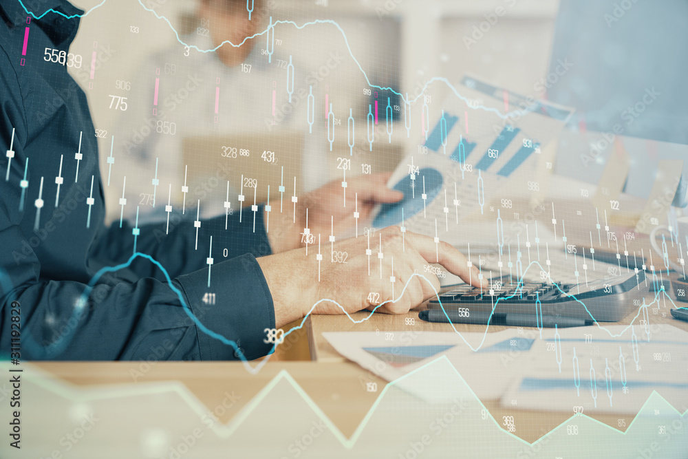 Double exposure of graph with man typing on computer in office on background. Concept of hard work. Closeup. Double exposure of graph with man typing on computer in office on background. Concept of hard work. Closeup.