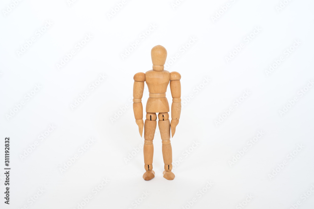 Wooden figure pose stand still on white background isolated object Wooden figure pose stand still on white background isolated object