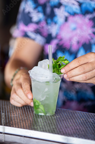 mohit cocktail, barman with colored t-shirt, summer photo