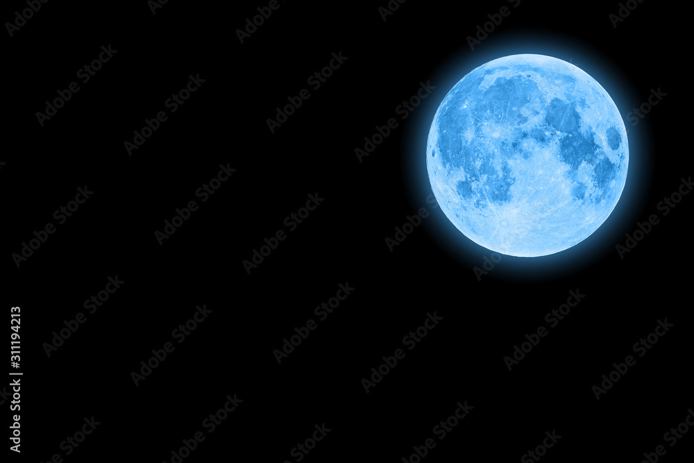 Blue super moon glowing with blue halo isolated on black background copy space on the left Blue super moon glowing with blue halo isolated on black background copy space on the left
