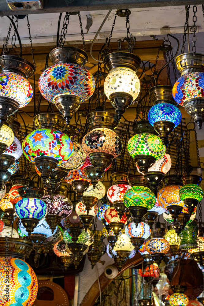 detail of some little coloured lamps hanging on the ceiling of a tourist shop in valencia
