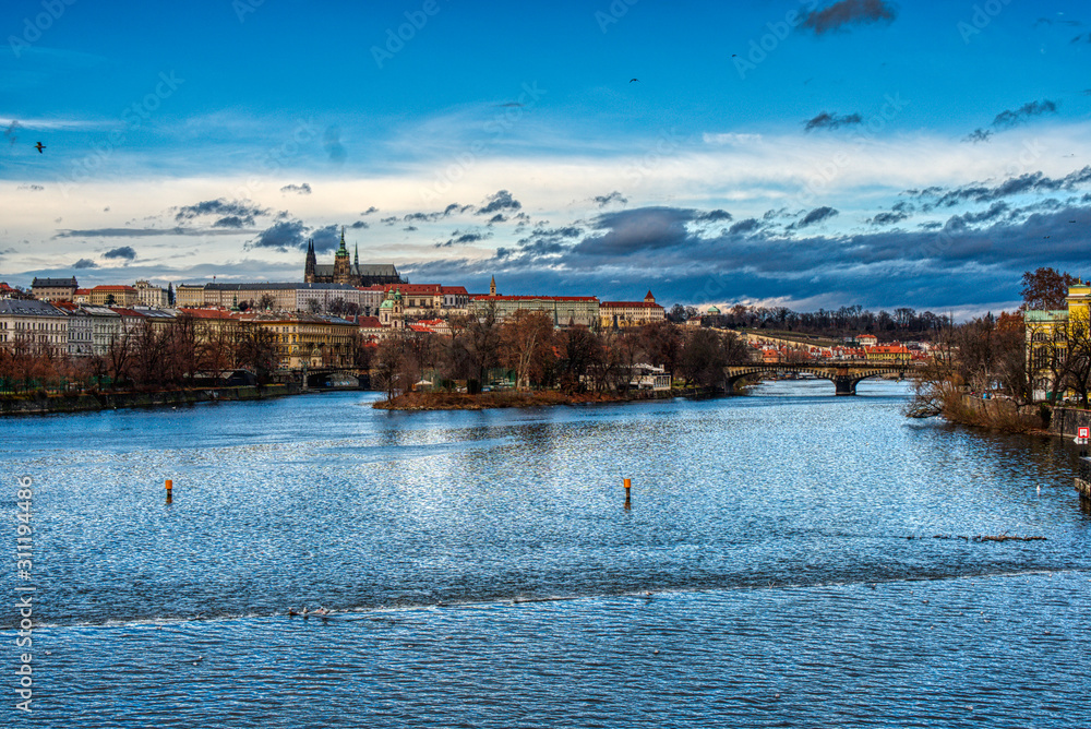 Charles Bridge with castle and cathedral in the center of Prague