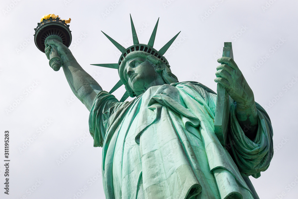 Fototapeta premium Looking Up at the Statue of Liberty in New York