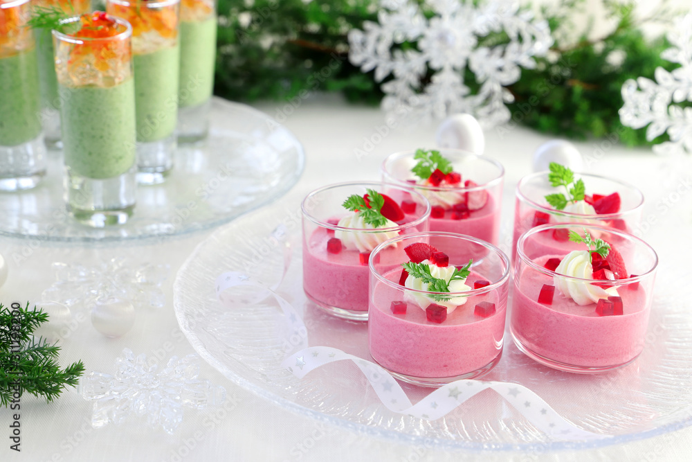 Christmas appetizers, mousse with beetroot , avocado and spinach in glasses. Christmas appetizers, mousse with beetroot , avocado and spinach in glasses.