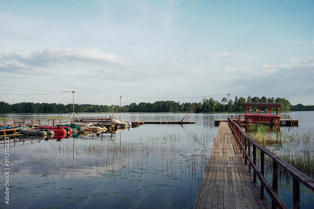 wooden pier for boats Lake Forest landscape nature fishing holid