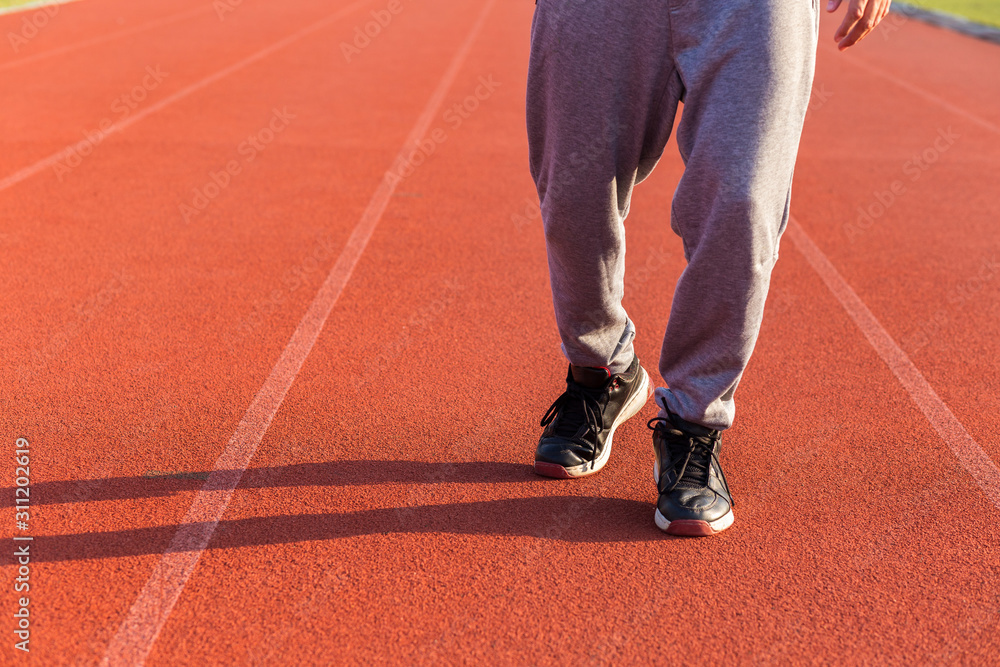 Sport Man jogging or exercise on track race at Stadium.Sport concept. Sport Man jogging or exercise on track race at Stadium.Sport concept.