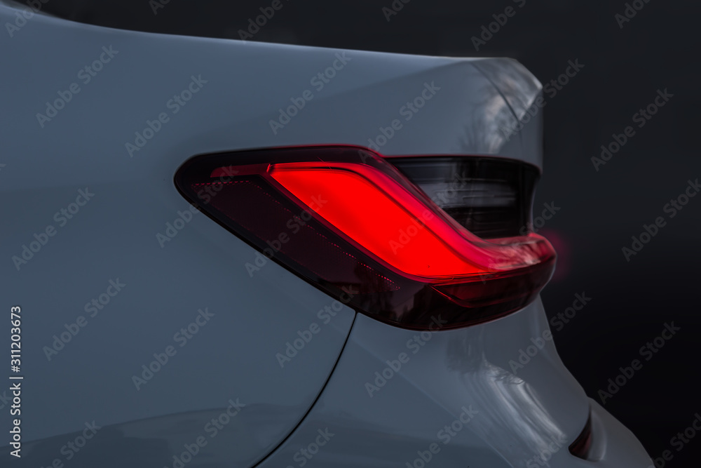 Red taillight of a modern car.