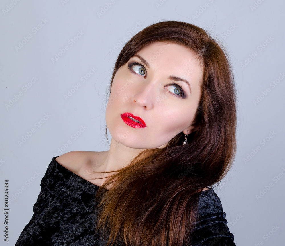 Portrait of a woman on a gray background Portrait of a woman on a gray background