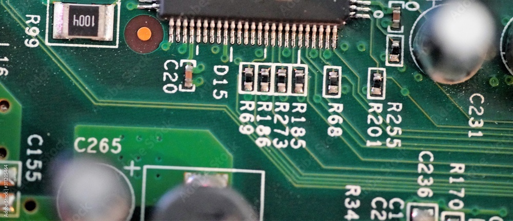 Macro view on micro circuit integrated board with chip details Macro view on micro circuit integrated board with chip details