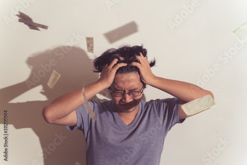 A chinese man are feeling stressed.