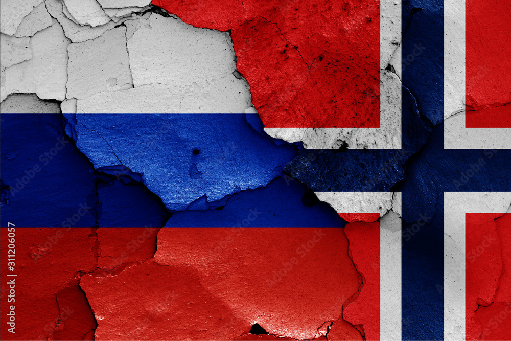 flags of Russia and Norway painted on cracked wall