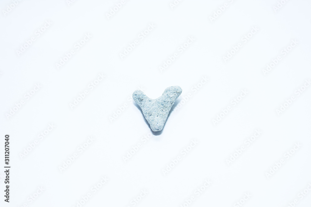 stone of porous mineral gray carved in the form of a heart stone of porous mineral gray carved in the form of a heart