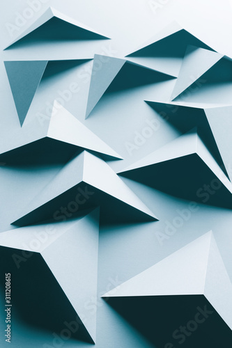 Abstract pattern made of colored paper  light blue background