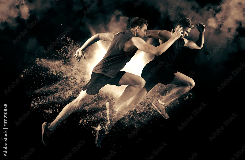 Athletic men sprinter running on smoke background