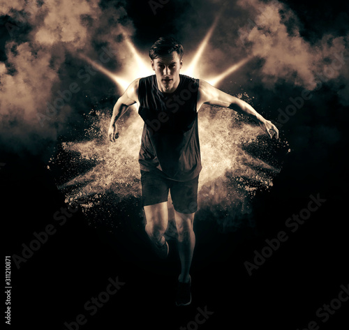 Athletic man sprinter running on smoke background © Andrey Burmakin