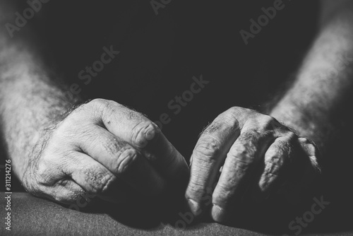 black and white photograph two relaxed hands