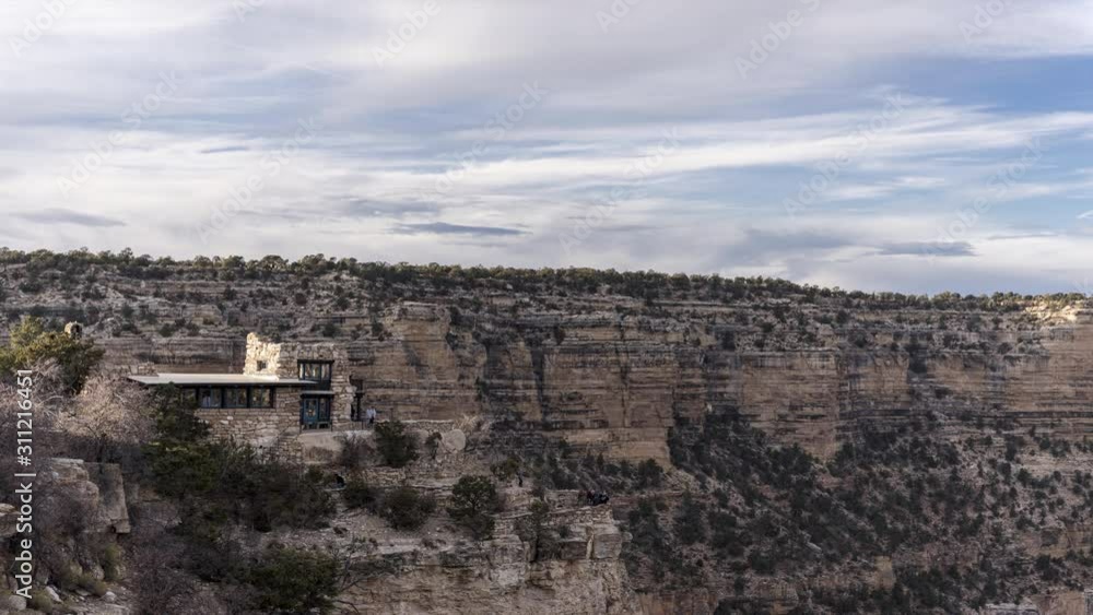 Clouds move across the Grand Canyon while overlooking Tusayan Museum at sundown. Clouds move across the Grand Canyon while overlooking Tusayan Museum at sundown.