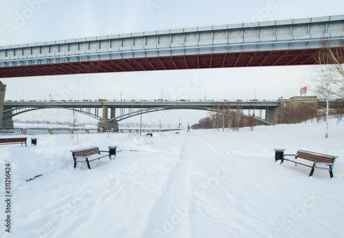 seafront covered with snow in winter and bridges over the river