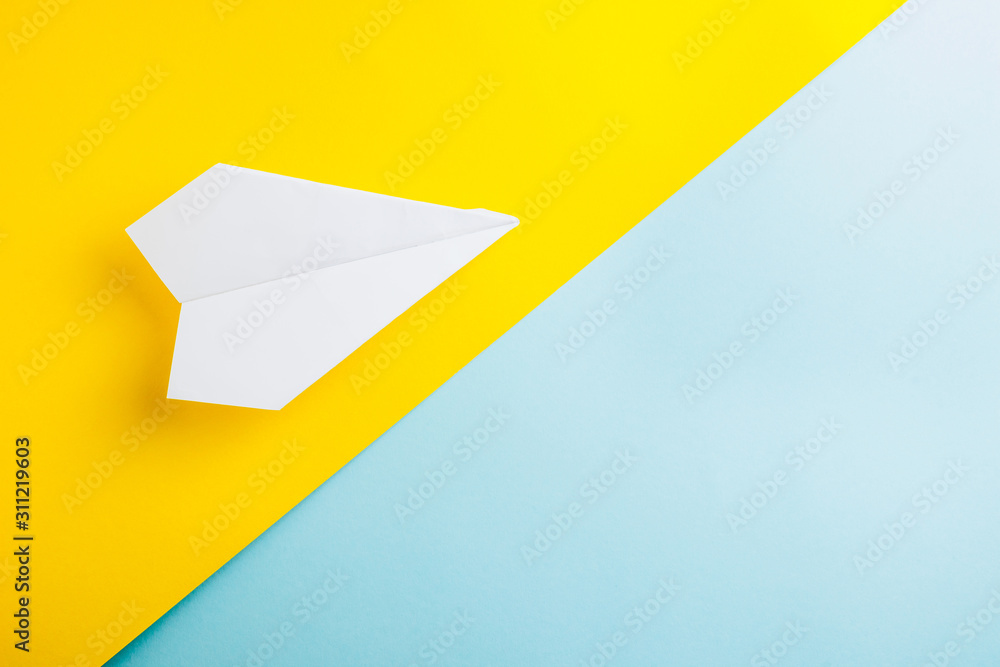 Traveler accessories on blue and yellow background with blank space for text. Flat lay, top view travel or vacation concept. Summer background. Traveler accessories on blue and yellow background with blank space for text. Flat lay, top view travel or vacation concept. Summer background.