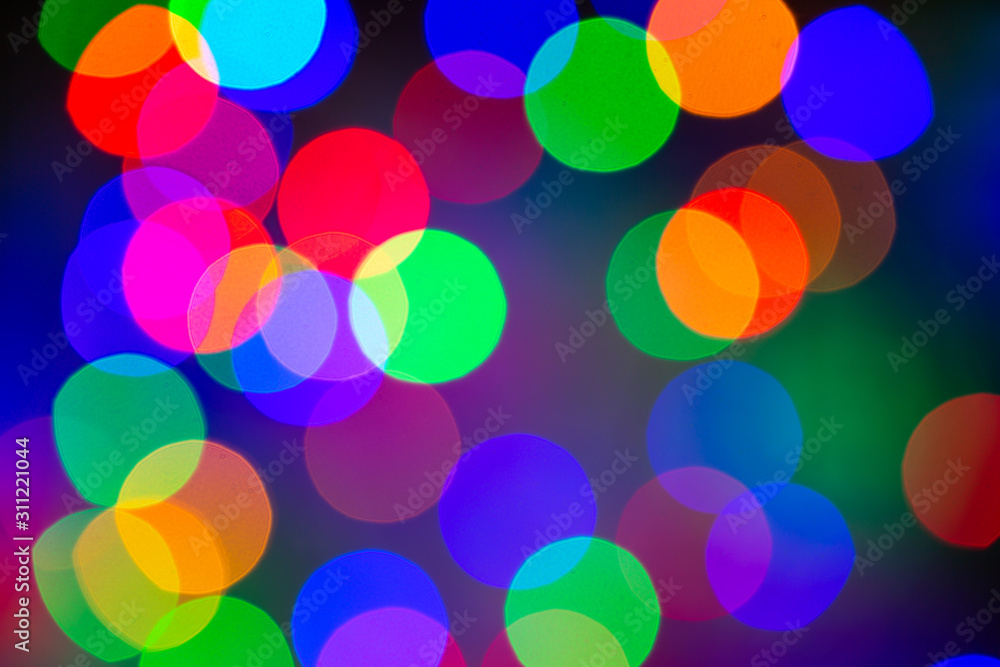Abstract multi colored Lights. Unfocused Light background. Blured christmas light. Blur concept.